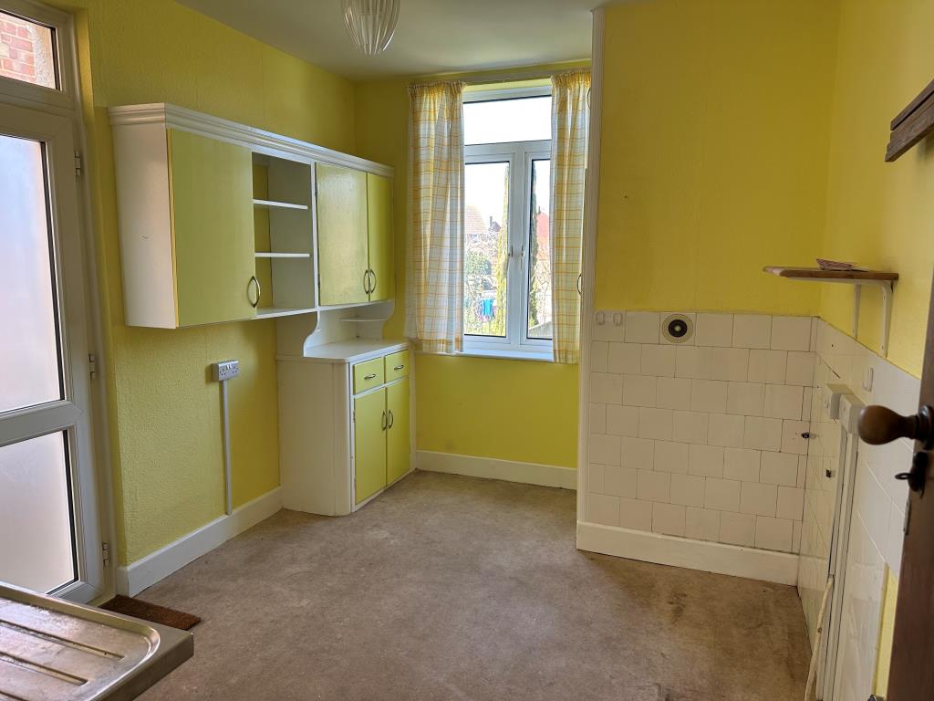 Lot: 149 - THREE-BEDROOM SEMI-DETACHED HOUSE - Kitchen with access into the garden